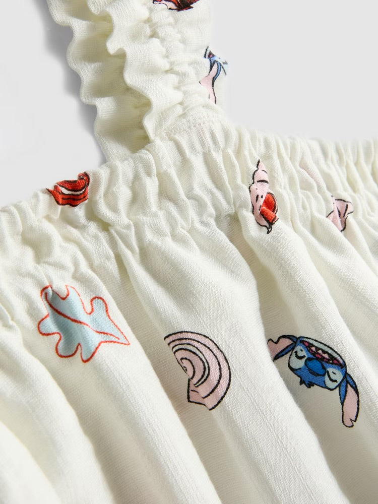 Une robe à encolure carrée ornée d'un motif intégral représentant Stitch.